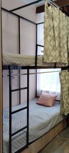 a couple of bunk beds in a room at Optimal in Vyshneve +11 photos