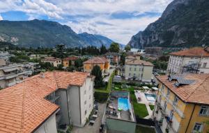 a view of a town with mountains in the background at Attic Suite Palme in Riva del Garda