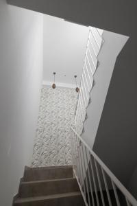 a staircase with white walls and a white stair case at lovely cityscape in Lagos