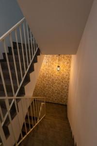 a staircase with a brick wall and a light at lovely cityscape in Lagos