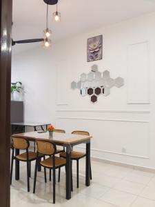 a dining room with a table and chairs at Yashz Guest House in Port Dickson