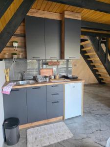a kitchen with a sink and a counter at Villa Sanja I Villa Aleksa in Bratunac +24 photos