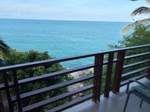 a balcony with a view of the ocean at Noahs Ark Beach in Nathon Bay