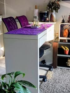 a purple counter top in a room with a plant at Jupiter in Split