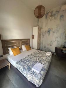 a bedroom with a bed and a desk in it at Villa Paradiso Batroun in Batroûn