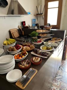 a buffet line with a lot of food on it at Villa Paradiso Batroun in Batroûn +25 photos