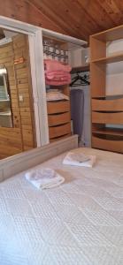 two towels are sitting on a bed in a bedroom at Cabanon 50m2 in Méounes-lès-Montrieux