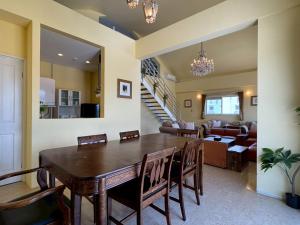 a dining room and living room with a table and chairs at Anniversario in Onna