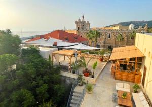 a view of a building with a restaurant and a building at Villa Paradiso Batroun in Batroûn