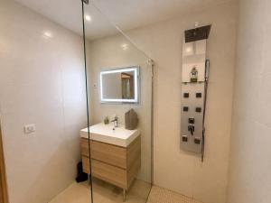a bathroom with a sink and a shower at La Ferronnerie Cassis centre in Cassis +16 photos