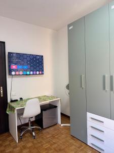 an office with a desk and a chair in a room at First Dream Mestre in Mestre