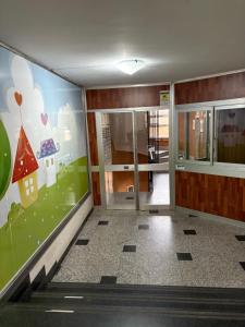 a room with a hallway with a door and a wall at M&S Home in Agrigento