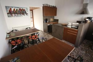 a kitchen with a table and some chairs in a room at Villa Paradiso Batroun in Batroûn