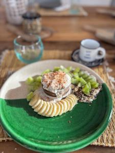 a plate of food on a table with food on it at Tempo Vegan B&B in Essaouira