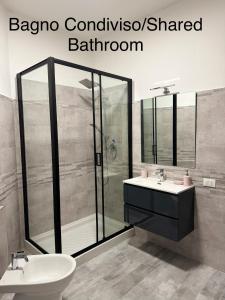 a bathroom with a shower and a sink and a toilet at First Dream Mestre in Mestre