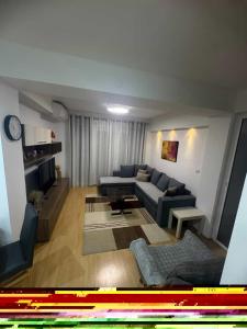 a living room with a couch and a table at Ohrid Demarko Apartment in Ohrid