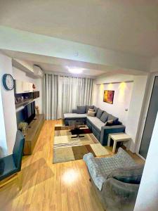 a living room with a couch and a table at Ohrid Demarko Apartment in Ohrid