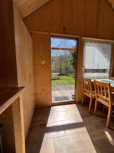 a view from the inside of a cabin with a table and chairs at BiesChatki in Wetlina