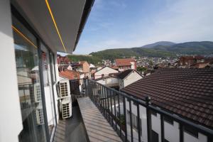 a balcony with a view of a city at Hotel Besfort in Prizren