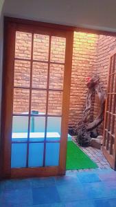 a front door of a house with a brick wall at Foodong Accommodation in Worcester
