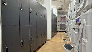 a hallway with gray lockers in a hospital at Beddy Hostels in Madrid +12 photos
