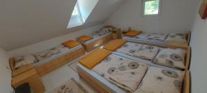 an overhead view of a room with four bunk beds at Boračko Lake View Apartment "doelend" in Konjic