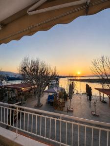 a view of a sunset from a balcony of a market at Sophia House in Keramoti