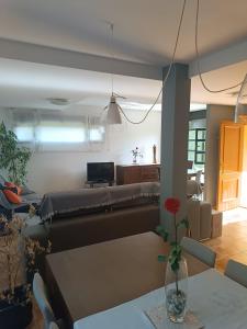 a living room with a couch and a table at La Vega in Cardeñadijo