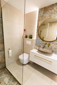 a bathroom with a toilet and a mirror at SoboLove in Sobolów +24 photos