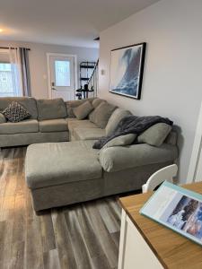 a living room with a couch and a table at Studio Guest Apartment in Dartmouth in Halifax