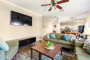 a living room with a couch and a table at Prospect Haus Stone Oak in San Antonio