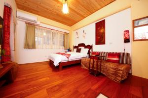 Letto o letti in una camera di Tang Chao B&B