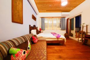 Letto o letti in una camera di Tang Chao B&B