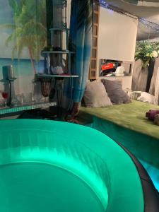 a room with a pool with a surfboard in it at Bonnye's guest house in Ramsgate