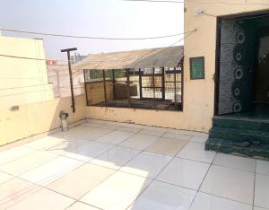 a room with a cage on the side of a building at PARADISE VILLA Near Prem Mandir in Vrindāvan