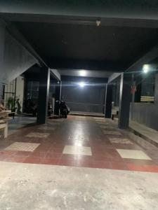 an empty hallway of a building at night at The 1802 backpackers hub in Shillong