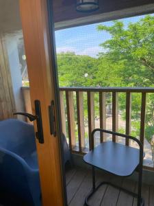 a table and a chair on a balcony at Cabbagetown Inn in Toronto