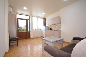 a living room with a couch and a table at Soma Apart-hotel in Center in Yerevan