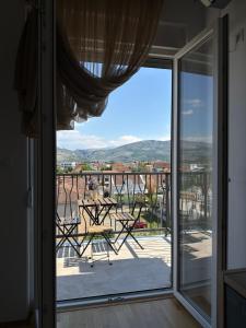 a view from the window of a balcony at Apartman Nadja in Podgorica