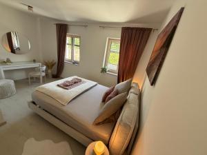 a bedroom with a large bed and a window at Donau Vibes Luxury Family near City and Highway in Linz