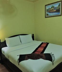 מיטה או מיטות בחדר ב-BKC villa