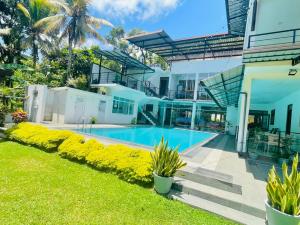 an image of a house with a swimming pool at New Lavan Bolgoda in Piliyandala
