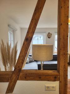 a room with a bed and a lamp in it at Schwarzwaldblick in Schramberg