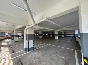 an empty parking lot in a parking garage at Nyvin Haven at The Loftel in Ruaka