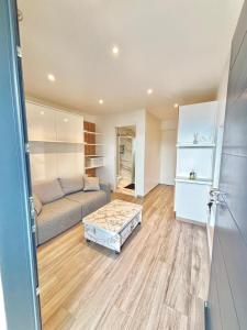 a living room with a couch and a coffee table at Cozy studio Annecy in Poisy +2 photos