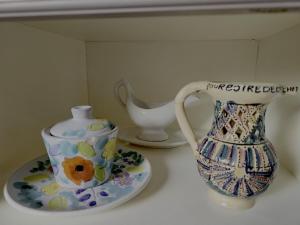 a vase and a pitcher sitting on a table at L'Orée des Bois in Paliseul +14 photos