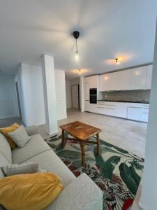 a living room with a couch and a table at Funicolare 64 in Paradiso