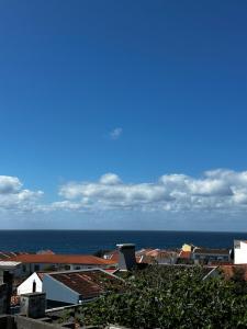 a view of a city with the ocean in the background at Coastal Sands Azores in Ribeira Grande