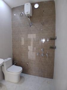 a bathroom with a toilet and a shower at BTL Kamakshi homez , 3bhk free parking, open dining, balcony in Ludhiana