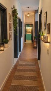 a hallway of a home with a wooden floor at BTL Kamakshi homez , 3bhk free parking, open dining, balcony in Ludhiana